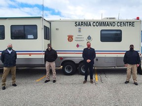 CAER's Vince Gagner, left, stands with Sarnia emergency management and corporate security officials Les Jones, Ron Realesmith and Carson Wilson. A new mobile command vehicle is being built to replace a nearly 30-year-old retrofitted recreational vehicle. (Submitted)