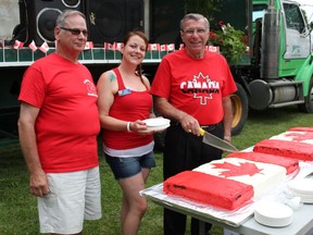 A file photo of Jim Martin, Adeana Bedard and former MP Guy Lauzon cutting Canada Day cake while celebrating Canada Day on Saturday July 4, 2015 in Morrisburg, Ont. Lois Ann Baker/Cornwall Standard-Freeholder/Postmedia Network