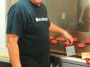 Kevin Syrette works his grill at Stackburger.