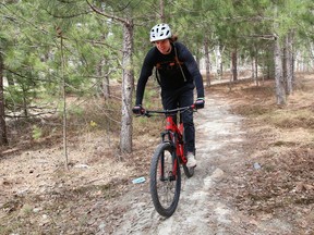 Alex Runciman rides a bike trail at Kivi Park in Sudbury, Ont. Kivi Park will partner with A&M Remediation to plant more than 10,000 trees in the park next month. John Lappa/Sudbury Star/Postmedia Network