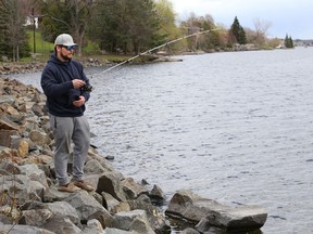 Seb Chartrand tries his luck at fishing at Ramsey Lake in Sudbury, Ont. on Friday May 7, 2021. John Lappa/Sudbury Star/Postmedia Network