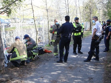 Greater Sudbury Fire Services, paramedics and police gathered for a potential water rescue at Junction Creek near Hnatyshyn Park in Sudbury, Ont. on Friday May 14, 2021. Rescuers were looking for two children, but they were later found with a family member. John Lappa/Sudbury Star/Postmedia Network