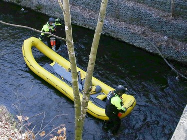 Greater Sudbury Fire Services, paramedics and police gathered for a potential water rescue at Junction Creek near Hnatyshyn Park in Sudbury, Ont. on Friday May 14, 2021. Rescuers were looking for two children, but they were later found with a family member. John Lappa/Sudbury Star/Postmedia Network