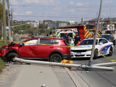 Police, the fire department, and paramedics attended a single-vehicle collision on Regent Street at Caswell Drive in Sudbury, Ont. on Monday May 17, 2021. A traffic light was knocked down. John Lappa/Sudbury Star/Postmedia Network