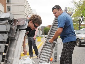 Laurentian University students assemble a remote-controlled excavation unit in this file photo. Scientists say mining in space is no longer just science fiction.