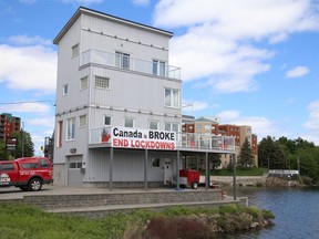 A sign posted on a building on Paris Street in Sudbury, Ont. calls for the end of lockdowns. John Lappa/Sudbury Star/Postmedia Network