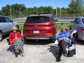 Karen Stewart, left, and Francine Jensen enjoy the sun and conversation while relaxing at James Jerome Sports Complex in Sudbury, Ont. on Friday May 28, 2021. John Lappa/Sudbury Star/Postmedia Network