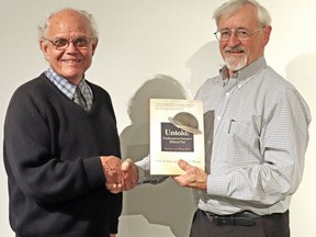 Historians Graeme Mount, left, and Dieter Buse were awarded the Ontario Historical Society's Fred Landon Award for their two-volume set Untold: Northeastern Ontario's Military Past. Buse worries that because of cuts at Laurentian University, Sudbury and the North will lose their history. Supplied photo
