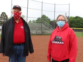 Charles Barclay and Kim Lyons, members of the Camlachie Athletic Association, stand on a currently unused ball diamonds in Camlachie. The association is urging supporters to contact Sarnia-Lambton MPP Bob Bailey to lobby for a change in provincial COVID reopening plans and allow an earlier return for youth ball leagues this summer. Paul Morden/Postmedia Network