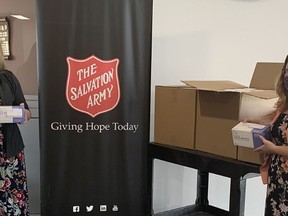 Sarnia Family Dental's Amanda Brand (left) drops off a donation of hand sanitizer and face masks at the Salvation Army. Handout/Sarnia This Week