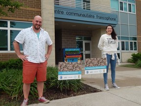 The Centre Communautaire Francophone de Sarnia-Lambton's David Lauzier and Anna-Luisa Cortez stand beside a pair of #AllAreWelcomeHere/#TousSontLesBienvenusIci signs, part of a county-wide initiative undertaken by the Sarnia-Lambton Local Immigration Partnership to promote inclusivity and diversity within the community.  Carl Hnatyshyn/Sarnia This Week