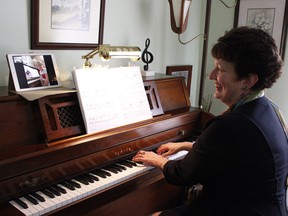 Lynn Pigeon, a registered music teacher and the president of the Ontario Registered Music Teacher's Association in Timmins, uses FaceTime to conduct a piano lesson with one of her students. 

RICHA BHOSALE/The Daily Press