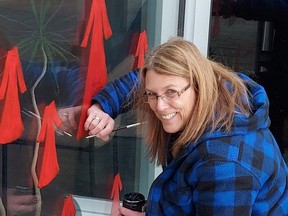 Brenda Beaven, Timmins Police community liaison coordinator, was decorating the front entrance of Timmins Police Service headquarters station to acknowledge May 5 as the National Day of Awareness for Missing and Murdered Indigenous Women and Girls. The empty red dress is the symbol recognized across Canada and it is meant to be a solemn reminder of those who lost their lives due to violence and gender or ethnicity-based hatred.

Supplied