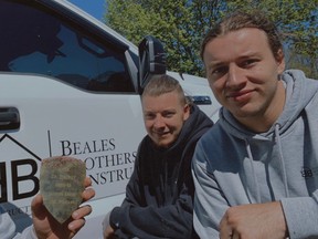 The Beales brothers behind local renovation company Beales Brothers Construction – Austin, left, Dylan and Brendan – found a 60-year-old hockey award behind a wall in a recent project and tried to find its rightful owner.