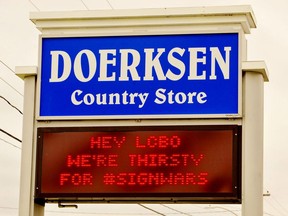 Businesses in Port Dover, Delhi and Port Rowan have joined the #SignWars marketing phenomenon that is sweeping North America. Above was the message flashing to motorists passing by Doerksen Country Market on Bay Street in Port Rowan on May 3. Monte Sonnenberg/Postmedia Network