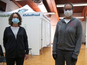 Val Harrop (left) and Bridget Fearon were the first two community volunteers assisting at the Mass Immunization Clinic in Tillsonburg on Monday. Recruited by the Town of Tillsonburg, a group of volunteers will be taking shifts to help with traffic flow, seating people and sanitizing stations at the clinic. (Chris Abbott/Norfolk & Tillsonburg News)