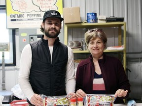 Tanner Townsend and his mother Livia Townsend show some of the products produced at their Ontario Popping Corn facility near Walsingham. ALEX HUNT