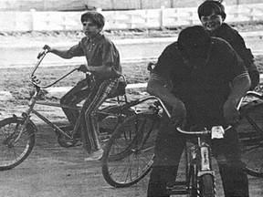 THE SEASON IS HERE- The past warm days would seem to have doubled the young population of Cochrane, mostly on bicycles. Students Andy Beaulne (left), Noel Leonard and Dwain Theriault pause for a chat before taking off.