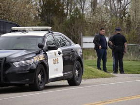 Oxford OPP officers were at The Bridges in Tillsonburg golf course Friday, taking notes and snapping photos of golfers. The golf course was charged Thursday night under the Reopening Ontario Act for violating the province's lockdown orders. KATHLEEN SAYLORS/SENTINEL-REVIEW