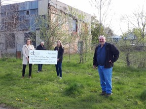 Doug Tarry, right, president of Doug Tarry Ltd., joins Lindsay Rice, left, of the St. Thomas-Elgin YWCA; Gerald Schipper of Sanctuary Homes; and Alexandra Hassen of Doug Tarry Ltd. after the builder donated $280,000 for cleanup of the former Elgin Handles property, where the YW, the builder and Sanctuary are partnering to constrict affordable housing.Submitted photo