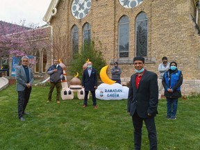 Javid Master, front right, is president of the new St. Thomas Islamic Centre, which held a drive-thru charity event Sunday for the Islamic holy month of Ramadan. (Eric Bunnell photo)