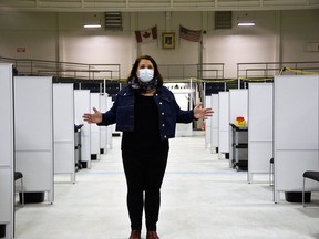 Jaime Fletcher, manager of the Southwestern Public Health COVID-19 vaccination task force, stands in front of the 36 vaccination stations on the arena surface at the St. Thomas-Elgin Memorial Arena. Kathleen Saylors/Postmedia Network