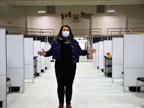 Jaime Fletcher, manager of the Southwestern Public Health COVID-19 vaccination task force, stands in front of the 36 vaccination stations on the arena surface at the St. Thomas-Elgin Memorial Arena. The clinic is set to close its doors next month. Kathleen Saylors/Postmedia Network