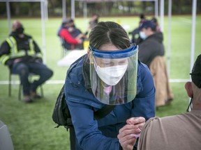 FILE: Dr. Katie Baldwin helps deliver vaccinations at the second Jabapalooza .