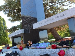 Pairs of shoes, flowers, stuffed animals and other items are shown in May at a memorial to residential school victims located near the cenotaph at the Aamjinaang First Nation administration office on Tashmoo Avenue at Sarnia.