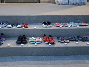 Small pairs of shoes seen on the steps of the Pro-Cathedral of the Assumption in North Bay. Supplied Photo