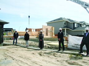 The walls went up for four new Habitat for Humanity homes in Leduc last week. Local politicians and stakeholders gathered to mark the occasion. (Alex Boates)