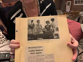 Carol Schaefer with a clipping froma 1979 Spruce Grove Examiner detailing the opening of the first women's wear store in the City. Submitted.
