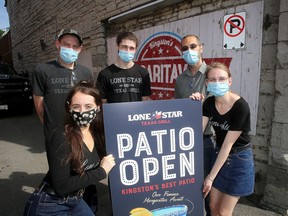 Staff at the Lone Star Restaurant on Ontario Street said they are looking forward to seeing customers on their newly renovated patio. From left Brianna "Half-Pint" Toscano, Andrew "Boomhour" Hughes,  Jason, "Doc" Rollings, Colin "Denver" Bowman and Kassidee "Muffin" McCormick. Ian MacAlpine/The Whig-Standard/Postmedia Network)