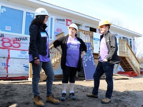 Katie Blunt, executive director of Habitat for Humanity Sault Ste. Marie & Area, Casey Gardner and board chair Dave Thompson speak at a build project in May 2019.  ORG XMIT: POS1905131415308726