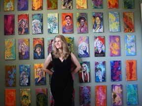 Veronica Funk stands infront of her Extraordinary Women project. Funk was featured on the cover of What Women Create Magazine in June.