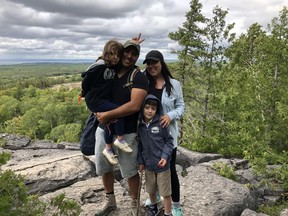 Chief Reginald (Reg) Niganobe and partner Juels, with his children, hiking on Manitoulin Island.