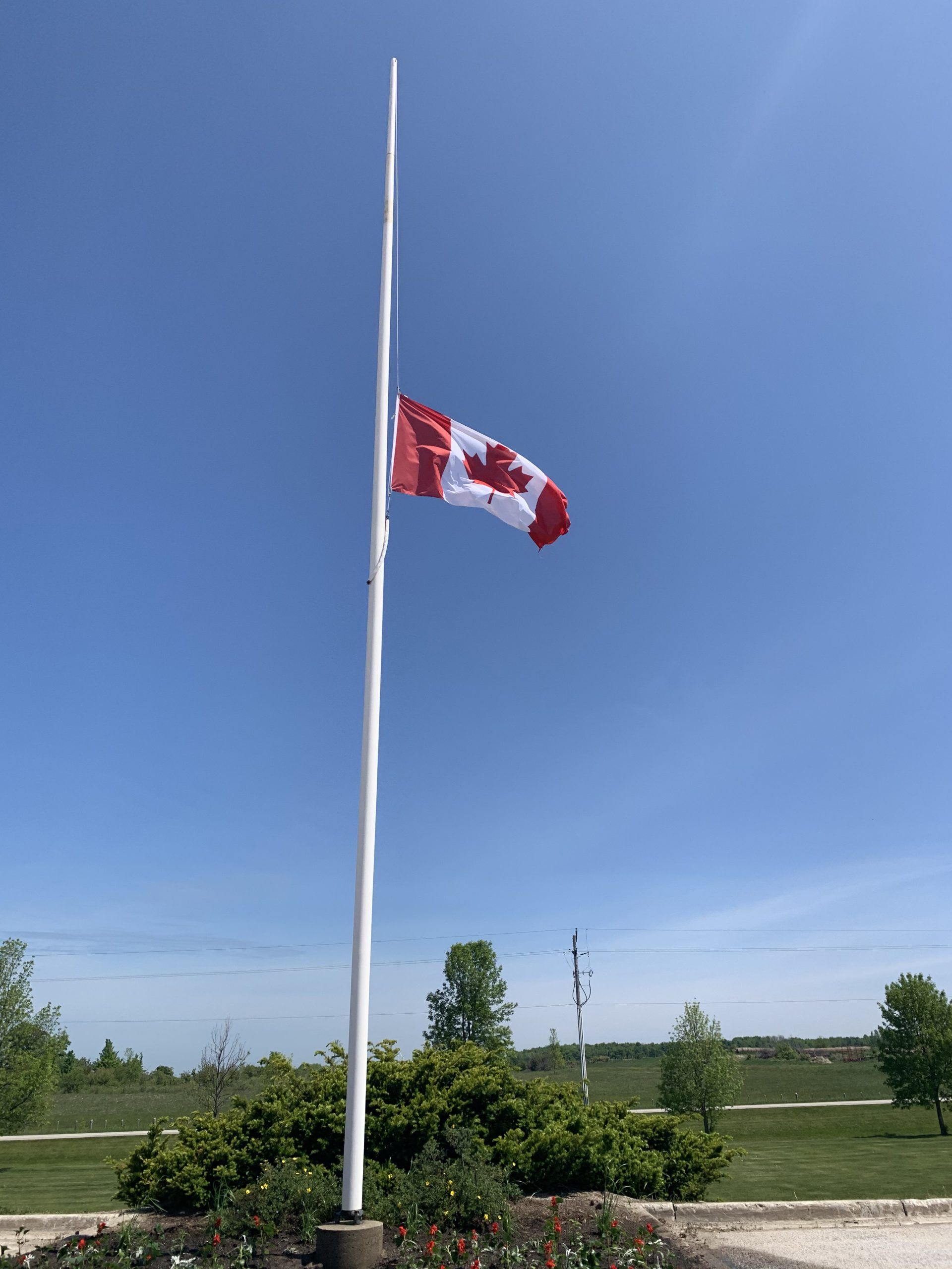 Flags fly at halfmast to remember the 215 children found buried at
