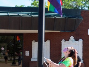 Emma St. John, youth ambassador with Out Loud, raises the Pride flag at North Bay City Hall, Wednesday morning.
PJ Wilson/The Nugget