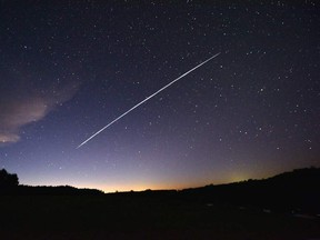 This long-exposure file image shows the trail of a group of SpaceX's Starlink satellites passing over Uruguay as seen from the countryside some 185 km north of Montevideo near Capilla del Sauce, Florida Department, on Feb. 7.