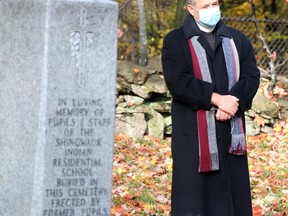 Dean James McShane, of St. Luke's Cathedral, visits Shingwauk Cemetery at Algoma University on Saturday, Oct. 17, 2020 in Sault Ste. Marie, Ont. (BRIAN KELLY/THE SAULT STAR/POSTMEDIA NETWORK)