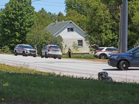 North Bay police are seen at a property on Ski Club Road, Thursday afternoon, just east of Riddle Street. Michael Lee/The Nugget