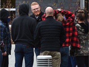 Pastor James Coates, centre, greeted by a group of supporters after being released from the Edmonton Remand Centre on March 22, 2021. PHOTO BY ED KAISER /Postmedia, file