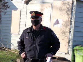 Sgt. Rob Chabot, of Sault Ste. Marie Police Service, stands in front of a property at 295 1st Ave., that was boarded up following an inspection by the integrated municipal enforcement team. BRIAN KELLY