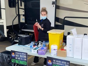 Kristina Hausauer at the drive-thru vaccination site at Casino Dene on June 9. PHOTO BY CLFN