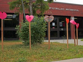 Hearts are seen outside M.T. Davidson Public School in Callander, Monday, for the 215 children whose graves were found at a former residential school in Kamloops, B.C. Michael Lee/The Nugget