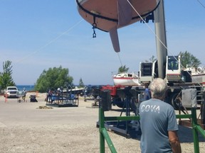 Some 40 boats – mostly sail and some power  – valued at approximately $5 million, used, were gracefully swung through the air by a crane from their summer cradles into Lake Huron at Port Elgin Harbour June 6.