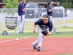 Yanick Loiselle of the Sudbury Voyageurs 18U baseball team keeps his eye on the ball during a drill at Terry Fox Sports Complex in Sudbury, Ontario on Saturday, June 12, 2021.