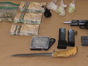 Norfolk OPP seized weapons, drugs and currency from a vehicle on Cockshutt Road near Waterford on Monday.