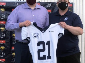 Ethan Galliford (pictured with Coach Schwartz) recently signed a contract to join the Edmonton Wildcats in the Canadian Junior Football League (CJFL) this summer.