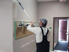 Mike Minderline worked on repainting Whitecourt and District Public Library in preparation for its reopening Monday, June 21. The library continues to offer contactless services in the meantime.
